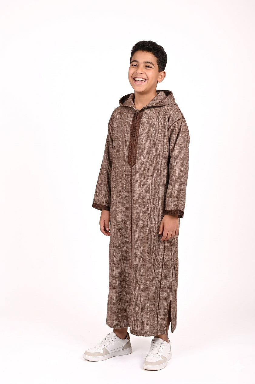 Kids' winter Djellaba by Al-Andalus featuring warm, cozy fabric and traditional Moroccan design with colorful patterns.