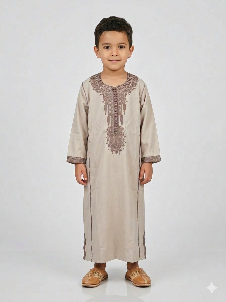 Colorful kids' kaftan from AL-ANDALUS featuring vibrant patterns and lightweight, comfortable fabric for children.