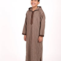 Kids' winter Djellaba by Al-Andalus featuring warm, cozy fabric and traditional Moroccan design with colorful patterns.
