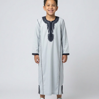 Colorful kids' kaftan by AL-ANDALUS with vibrant patterns, lightweight fabric, perfect for warm weather and casual wear.