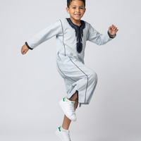 Colorful kids' kaftan by AL-ANDALUS featuring intricate patterns and lightweight fabric, perfect for comfortable summer wear.