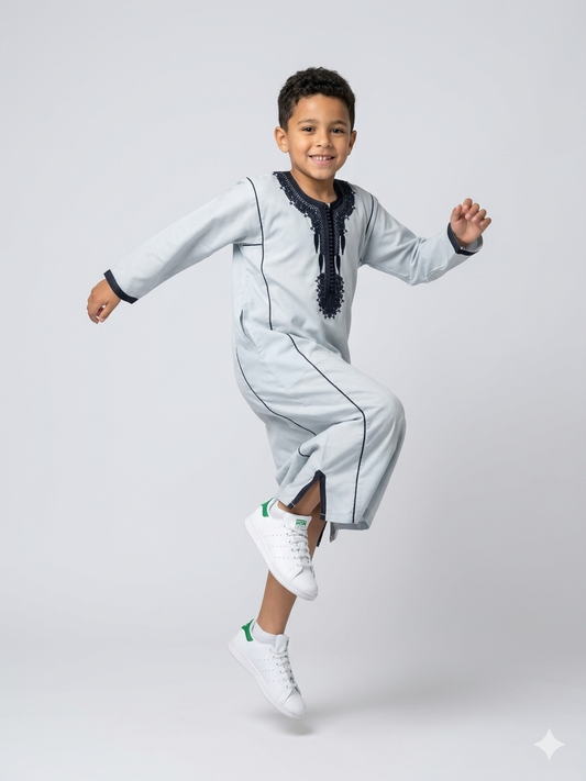 Colorful kids' kaftan by AL-ANDALUS featuring intricate patterns and lightweight fabric, perfect for comfortable summer wear.
