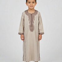 Colorful kids' kaftan from AL-ANDALUS featuring vibrant patterns and lightweight, comfortable fabric for children.