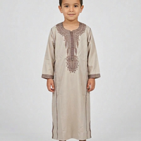 Colorful kids' kaftan from AL-ANDALUS featuring vibrant patterns and lightweight, comfortable fabric for children.