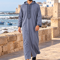 Blue Gray Soft Jellaba worn on an Essaouira coastal promenade