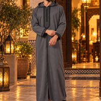 Dark Gray and Black Soft Jellaba worn outside a Marrakech riad at night